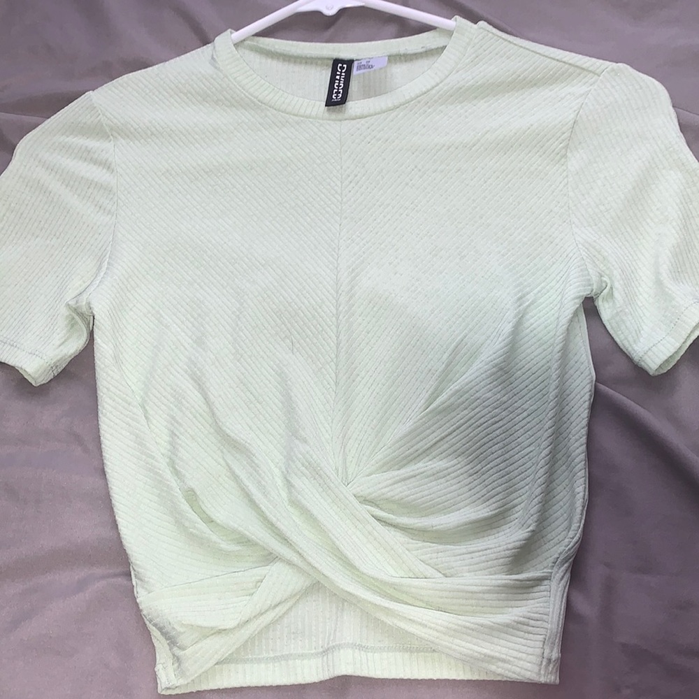 Mint green crop top with knot on the bottom
